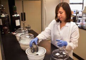 researcher testing samples